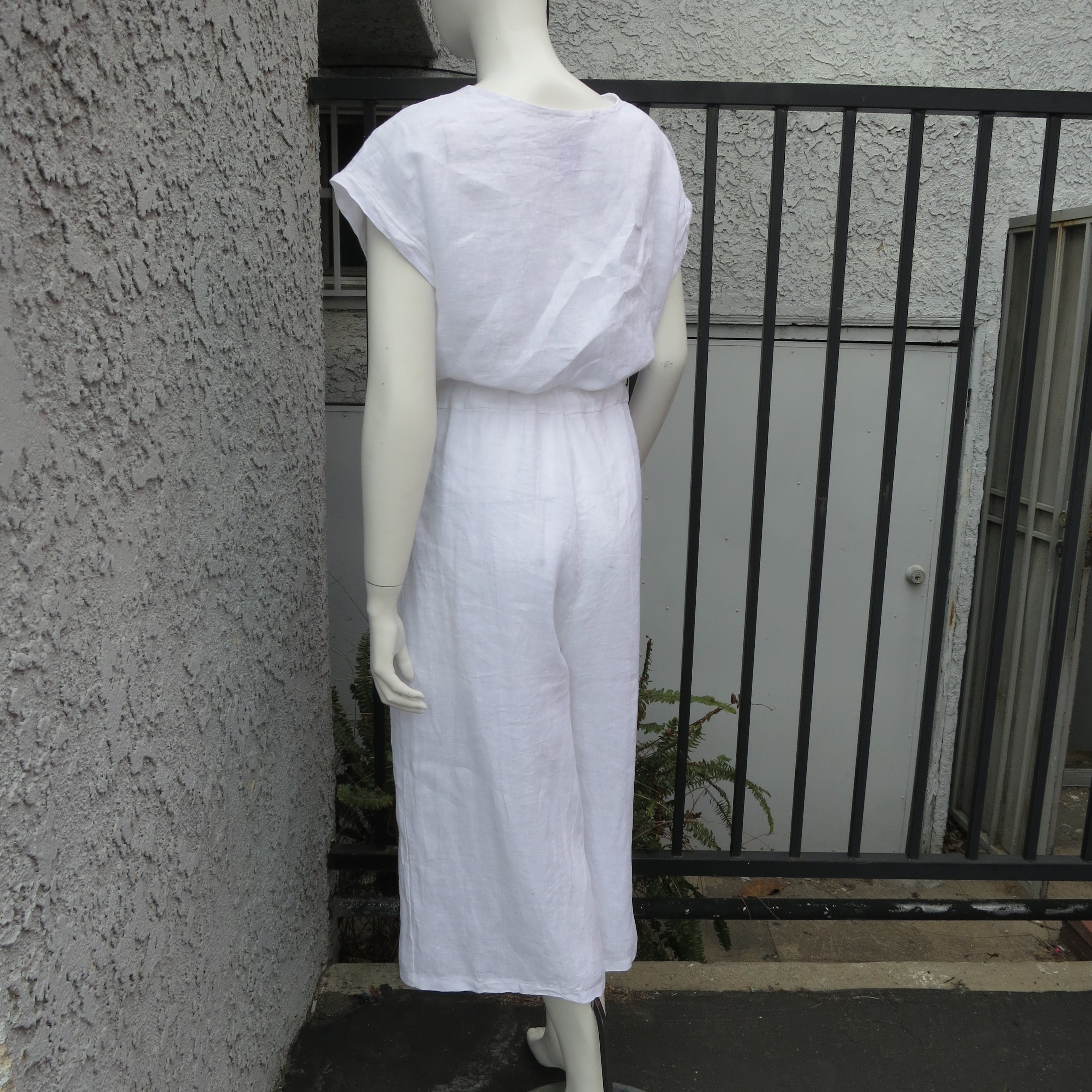 White linen cropped jumpsuit with drawstring waist